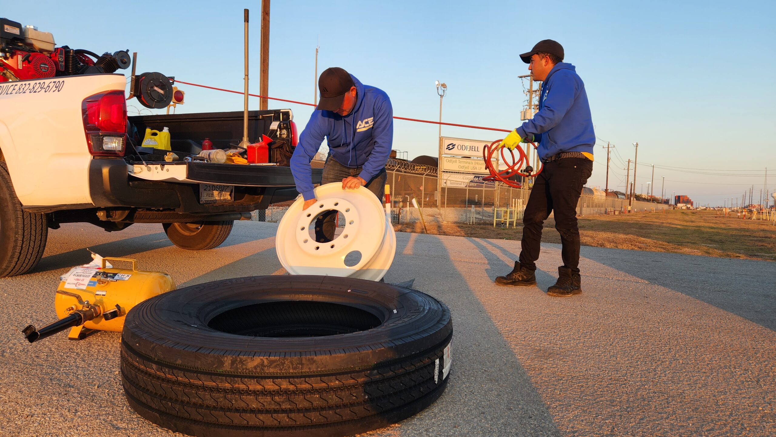 Mobile tire technicians replacing a flat tire in Katy Texas